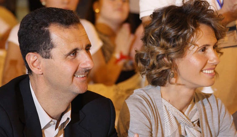 Syrian President Bashar Assad and his wi